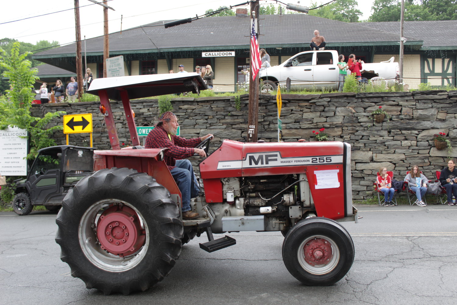 A Massey-Ferguson rumbles down Lower Main Street at the 2021 Callicoon Tractor Parade.